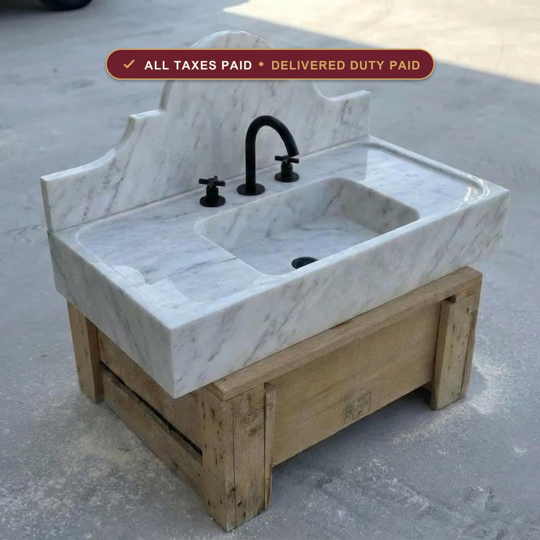 Custom Carrara marble rectangular vessel sink carved from a single block