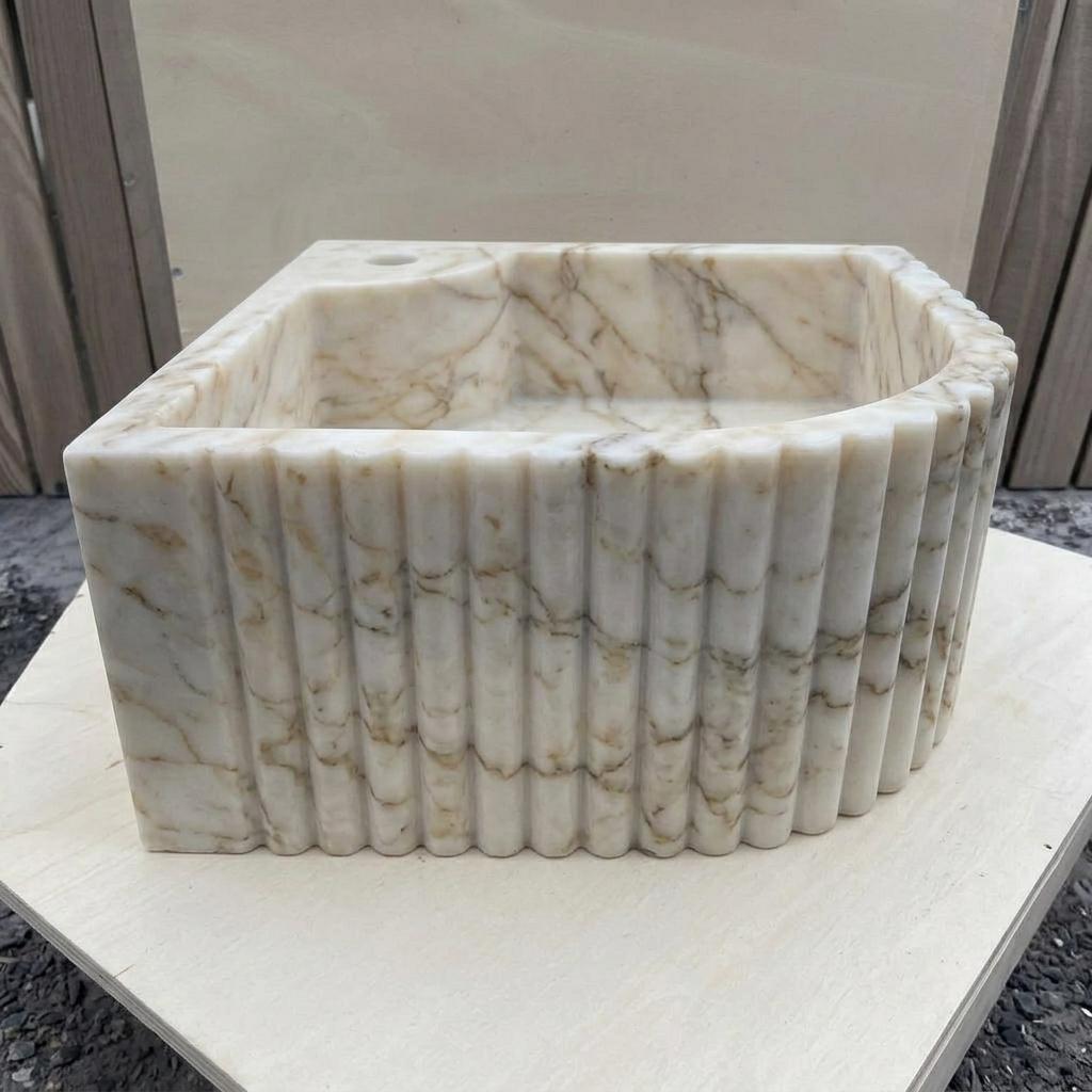 Calacatta Gold Marble fluted vessel sink — left side view (photo 3)