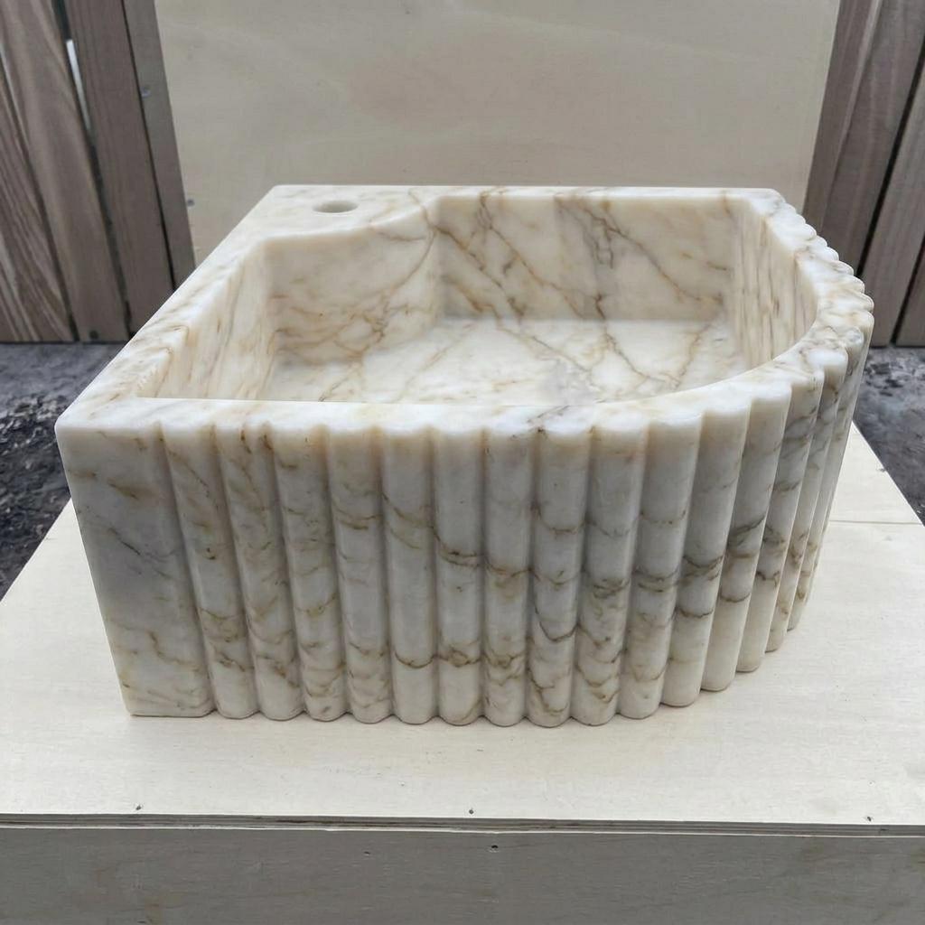 Calacatta Gold Marble fluted vessel sink — low-angle view (photo 12)