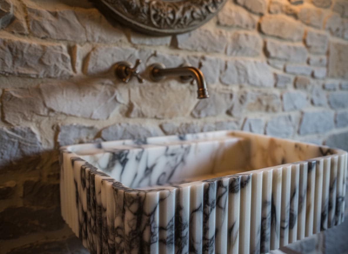 Handcarved Calacatta Viola marble wall mounted sink by Marblyart, custom made to order — photo 4 of 12
