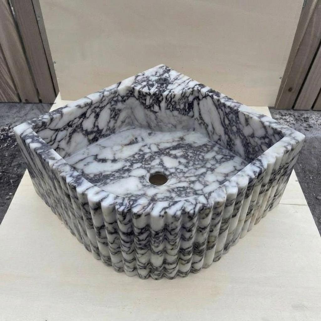 Calacatta Viola Marble fluted vessel sink — isometric three-quarter view (photo 7)