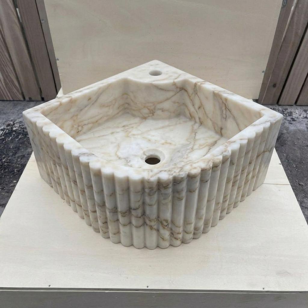 Calacatta Gold Marble fluted vessel sink — isometric three-quarter view (photo 6)